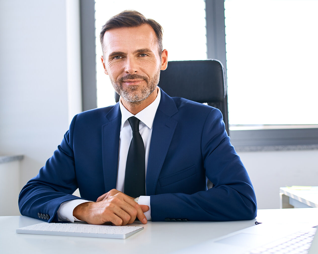 Office Executive at his desk, the director of WR8Tech