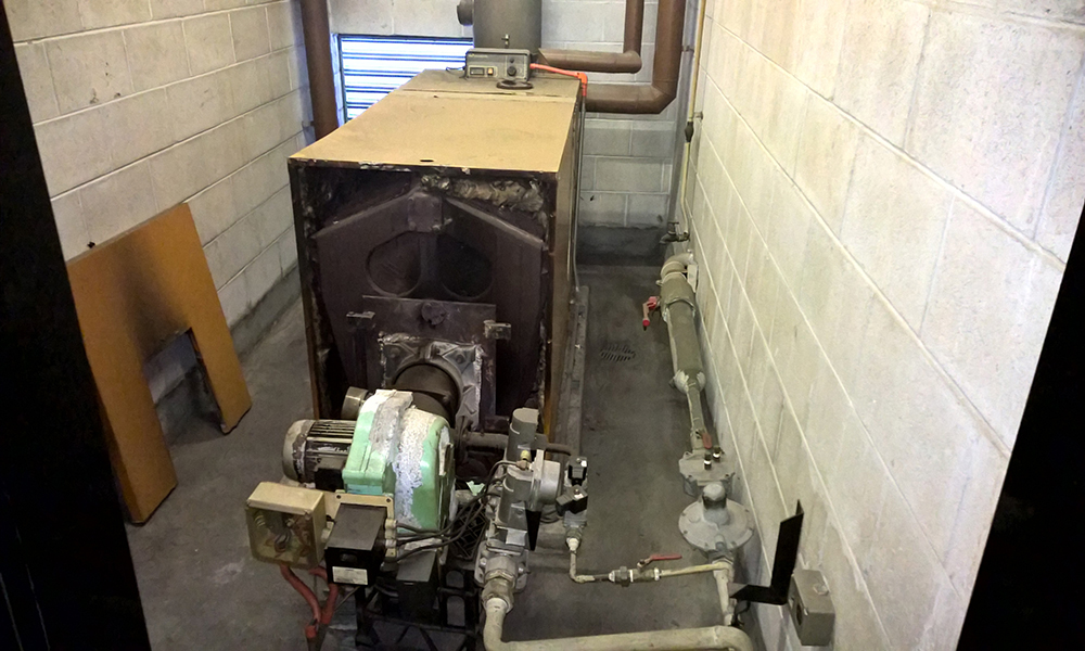 HVAC Mechanical Services Audit - HVAC Heating Hot water boiler being removed for upgrade to condensing boiler for greater energy efficiency and long-term use in Sydney CBD