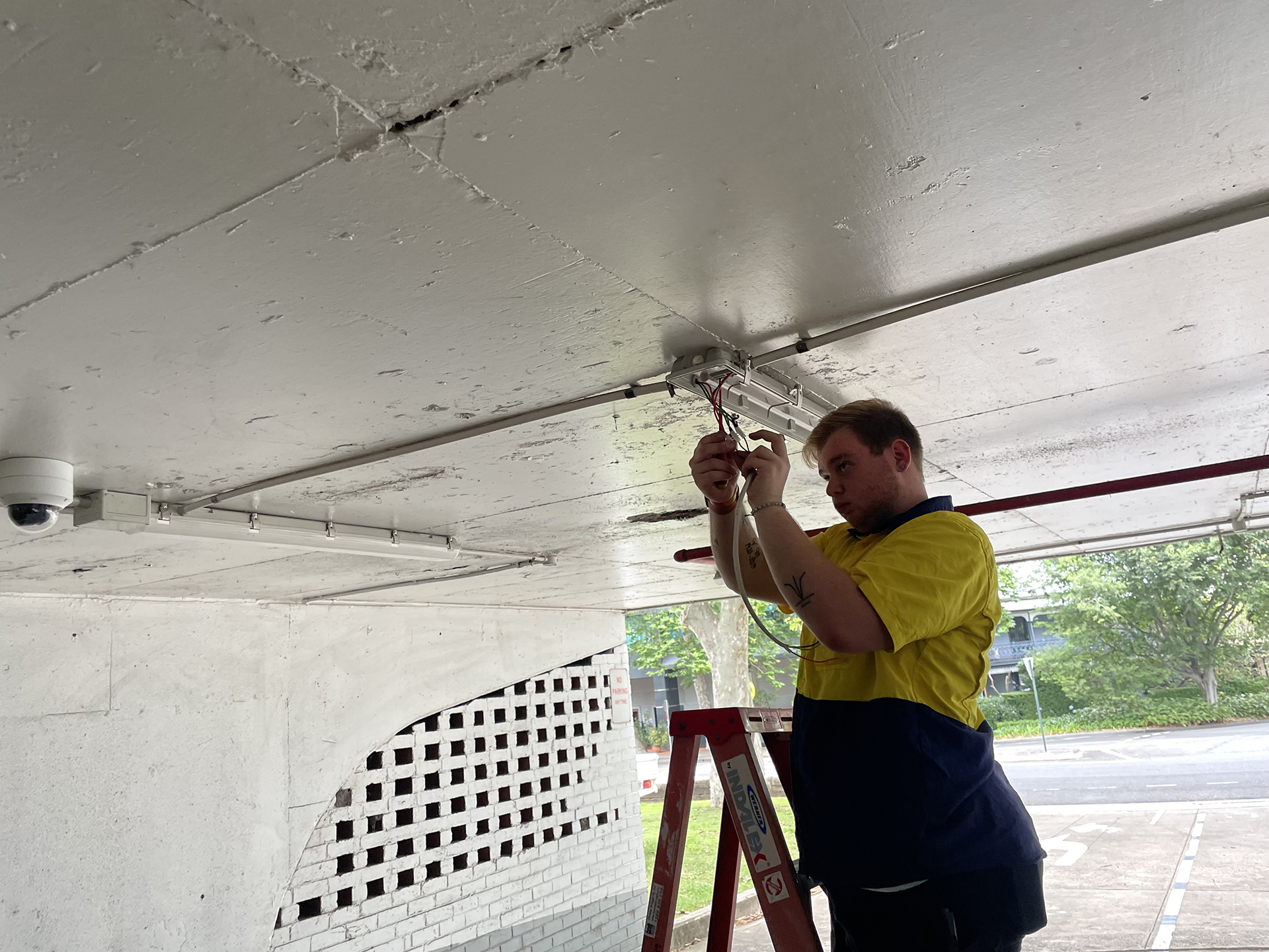 car park lighting upgrade - WR8TECh Electrician working on lighting upgrade at the domain car park in Sydney