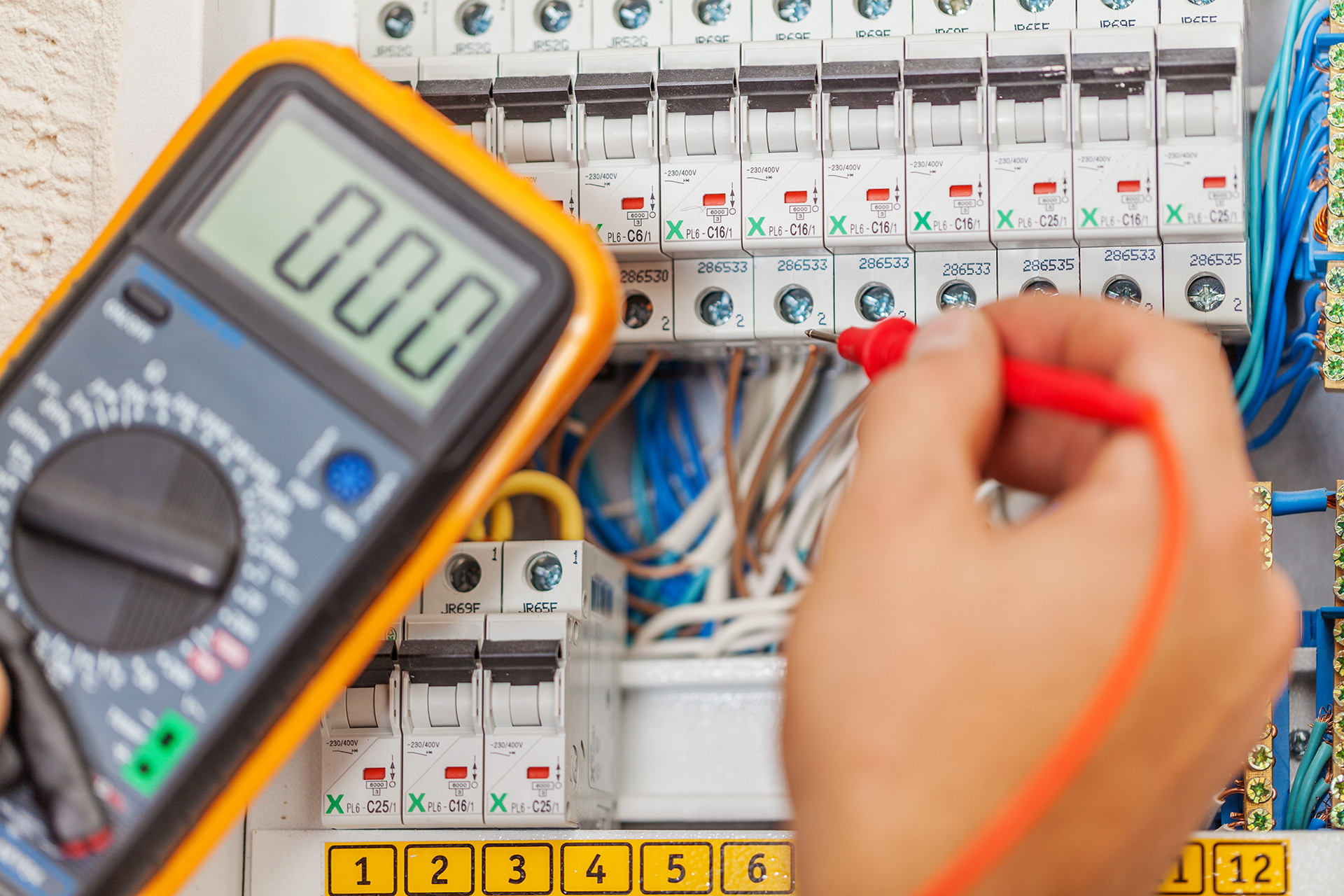 Electrcial Audit for commercial Buildings, Essential mechanical switchboard circuit breakers being tested for their connections into the HVAC mechanical system