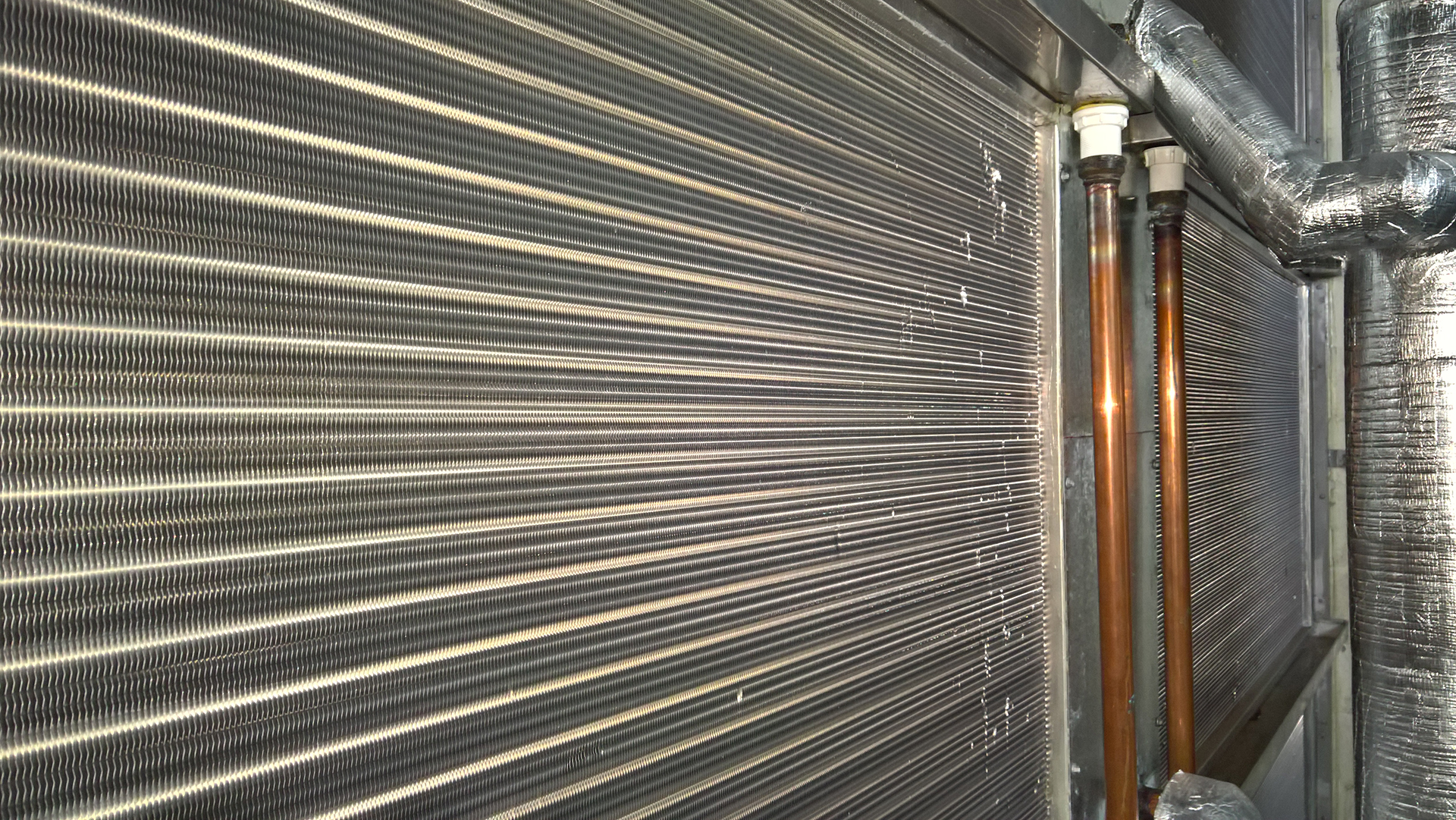 Sydney Building in Margaret street, the Air Handling unit has a cooling coil for the main supply air duct. this image shows the cooling coil with a valve controlled by the BMS