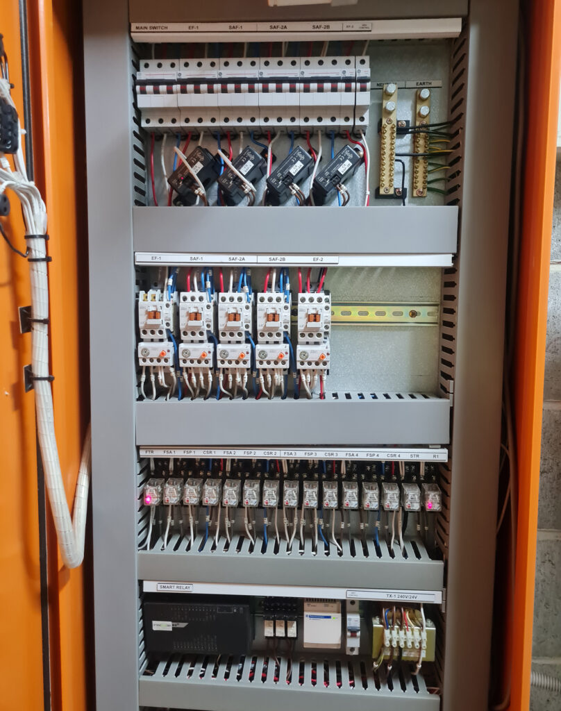Obsolete BMS - Electrcial and BMS projects combined - image is of a mechanical services HVAC motor control switchboard with the BMS controller installed at the bottom half - SYDNEY