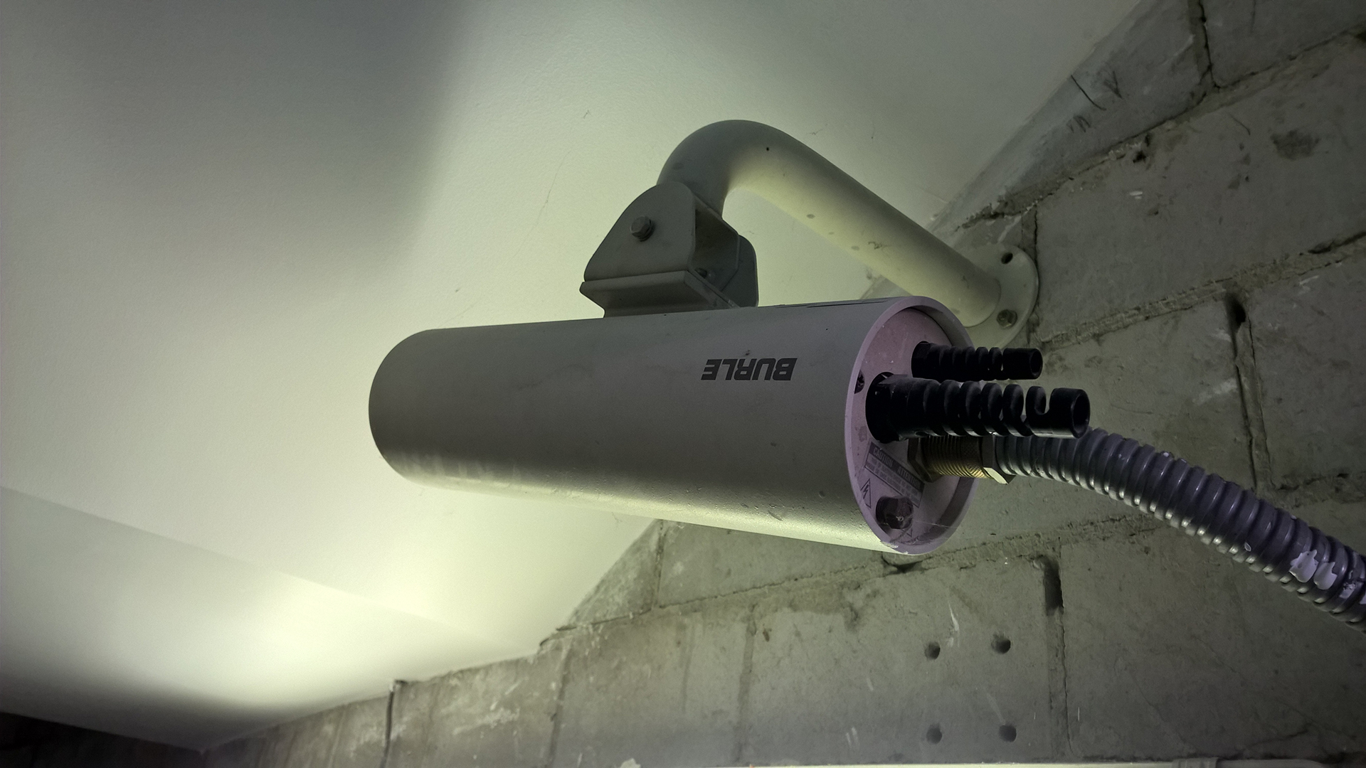 Unsupervised Buildings - a CCTV Camera fitted poorly facing upwards under a stair, this in a Sydney commercial Property building.