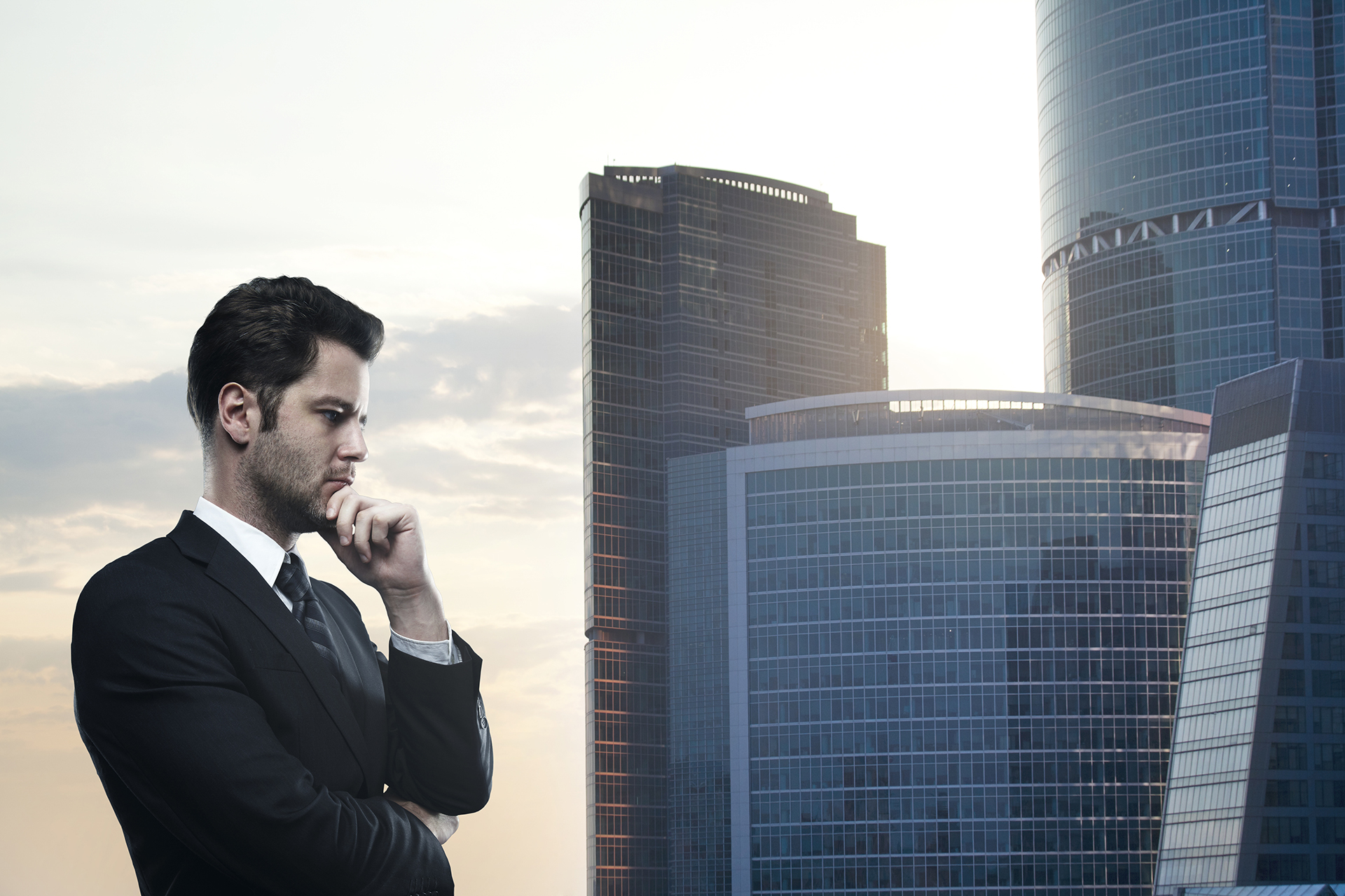 Suitable Building Types for Unsupervised Building Management

A larger-than-life executive stands overlooking a modern skyline of commercial office towers, thoughtfully assessing the future of building operations. The image conveys strategic decision-making and long-term asset management, with Melbourne Docklands' contemporary high-rise environment representing the type of commercial properties that can benefit from technology-enabled, unsupervised building management. Subtle digital overlays and technology-inspired lighting effects suggest the presence of Building Management Systems (BMS), remote monitoring platforms, energy management systems, and smart building analytics operating behind the scenes.

The image reflects the suitability of certain building types for remote operation and reduced on-site supervision, including commercial office buildings, mixed-use developments, retail centres, industrial facilities, hotels, car parks, and large strata complexes. Through the implementation of modern building technologies, cloud-based monitoring, automated fault detection, energy optimisation, contractor management systems, and integrated asset controls, these properties can maintain operational performance while reducing the need for full-time on-site building management.

Set against the backdrop of Melbourne Docklands, the image highlights how property owners, facility managers, landlords, and asset managers are increasingly evaluating technology-driven building operations to improve efficiency, reduce operating costs, enhance asset performance, and gain greater visibility across their property portfolios. It represents the strategic shift towards smarter, data-driven commercial building management supported by automation, connectivity, and intelligent building systems.