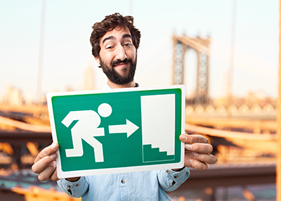 crazy man holding an emergency exit light