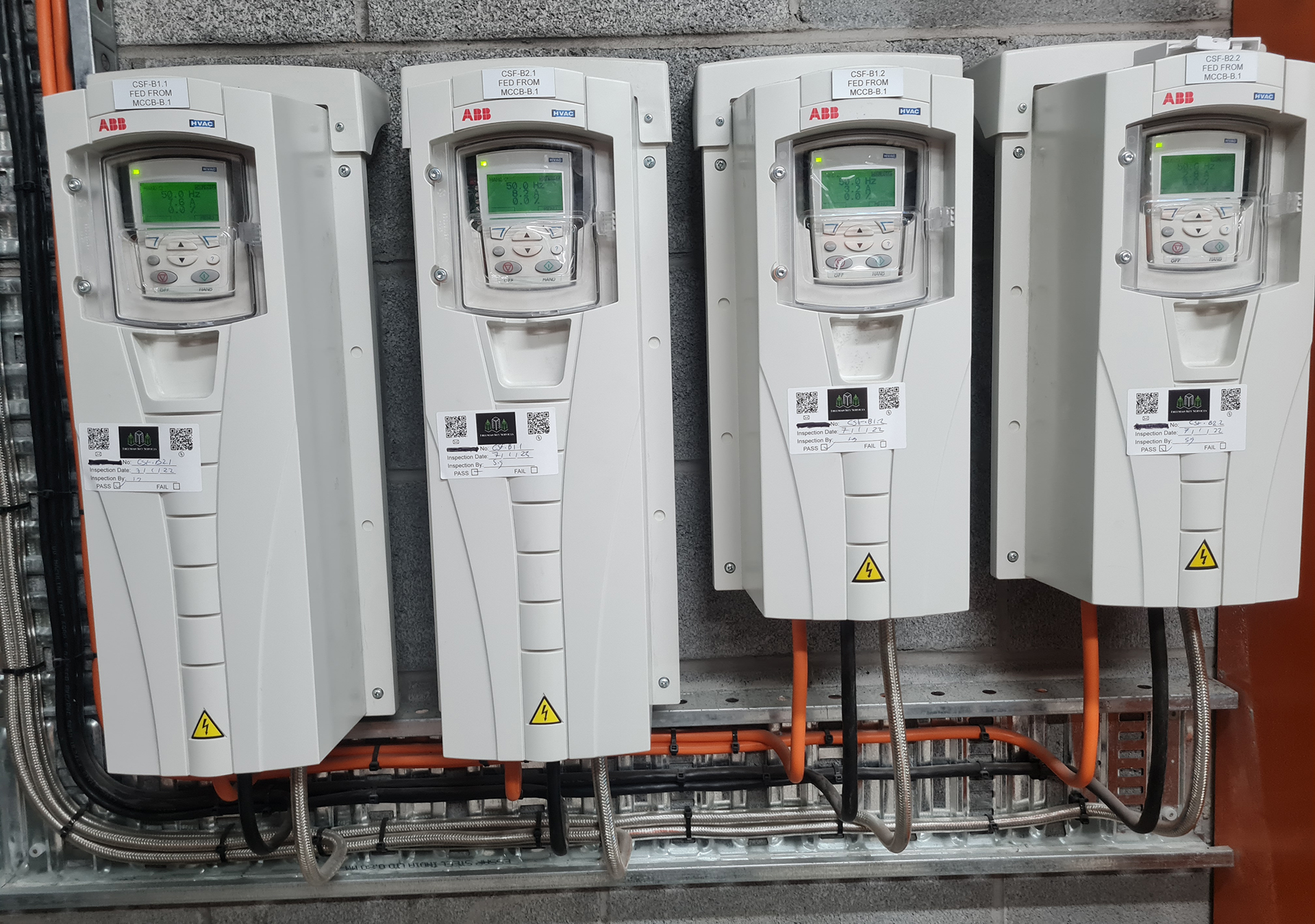 Two Danfoss VLT HVAC Variable Speed Drives controlling commercial car park exhaust fans in a Melbourne apartment building.