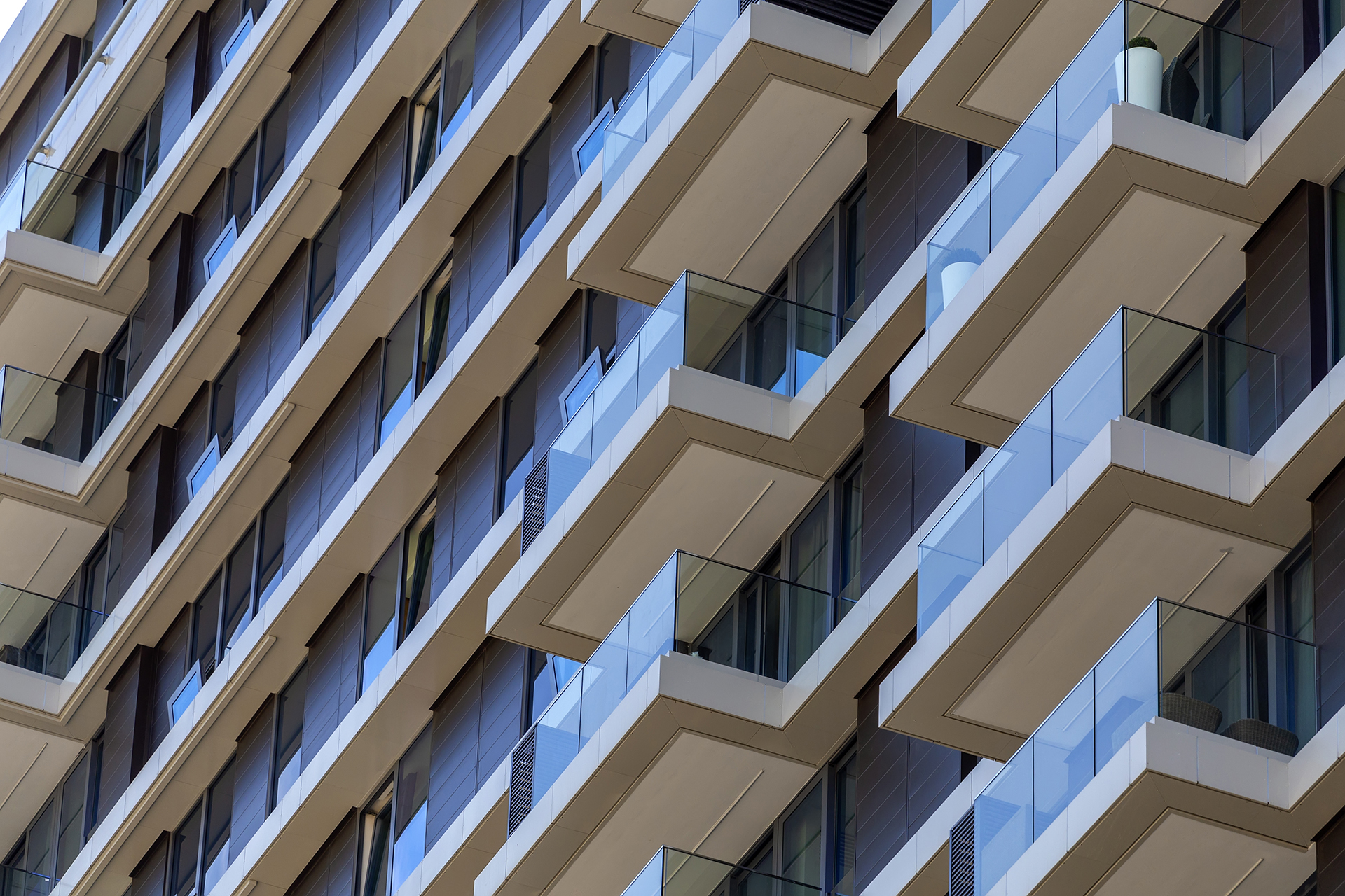 Modern apartment building façade highlighting the importance of ongoing maintenance, energy efficiency and asset preservation in residential buildings.