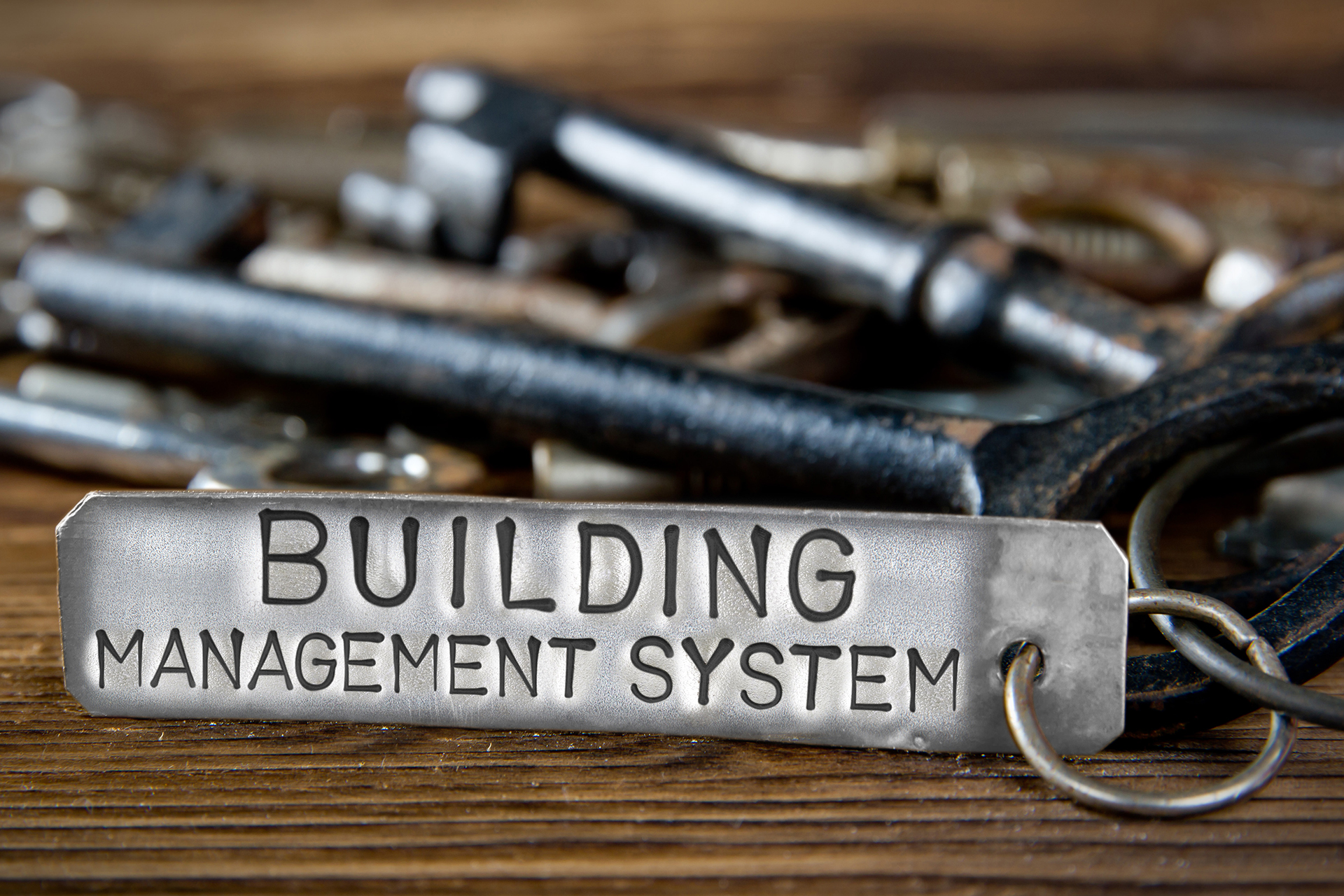 Building Management System key tag representing ownership, access and control of commercial building automation systems, highlighting the importance of avoiding vendor lock-in.