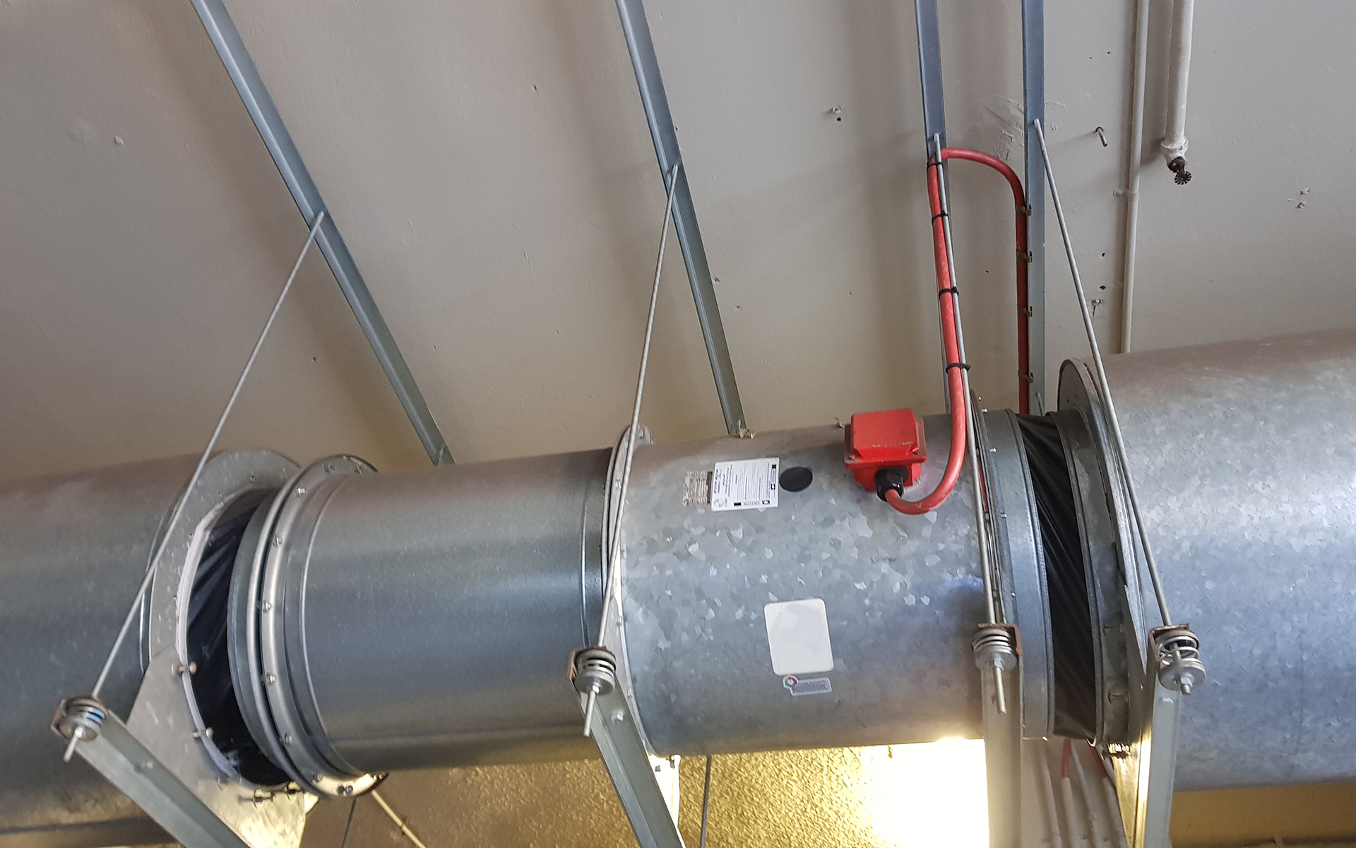 Commercial car park smoke exhaust fan connected to the Fire Indication Panel through the Mechanical Services Switchboard for smoke control during a fire emergency.