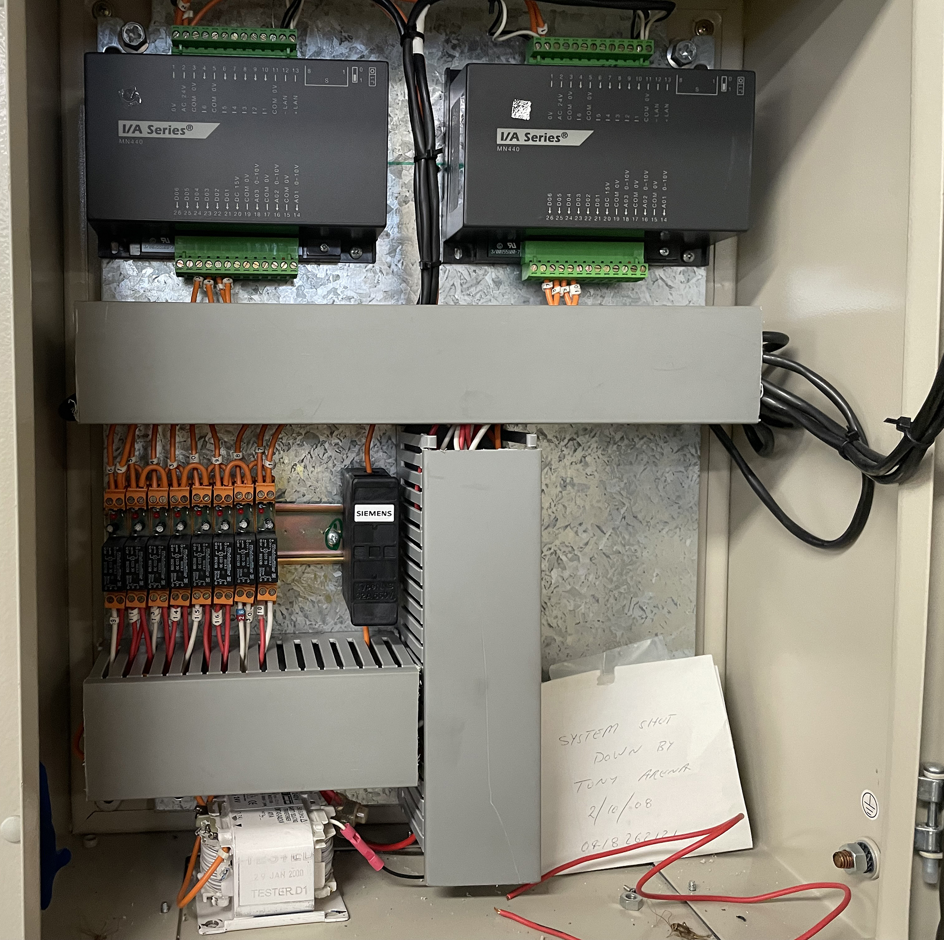 Building Management System field controller panel with I/O modules controlling a commercial carbon monoxide ventilation system.
