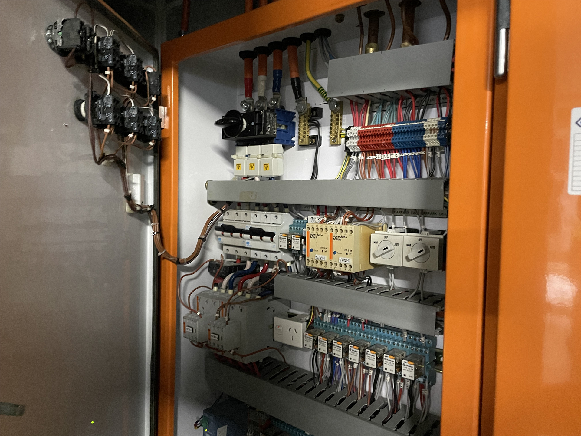 Hitachi EH-150 PLC controlling a commercial carbon monoxide ventilation system inside a basement car park control panel.