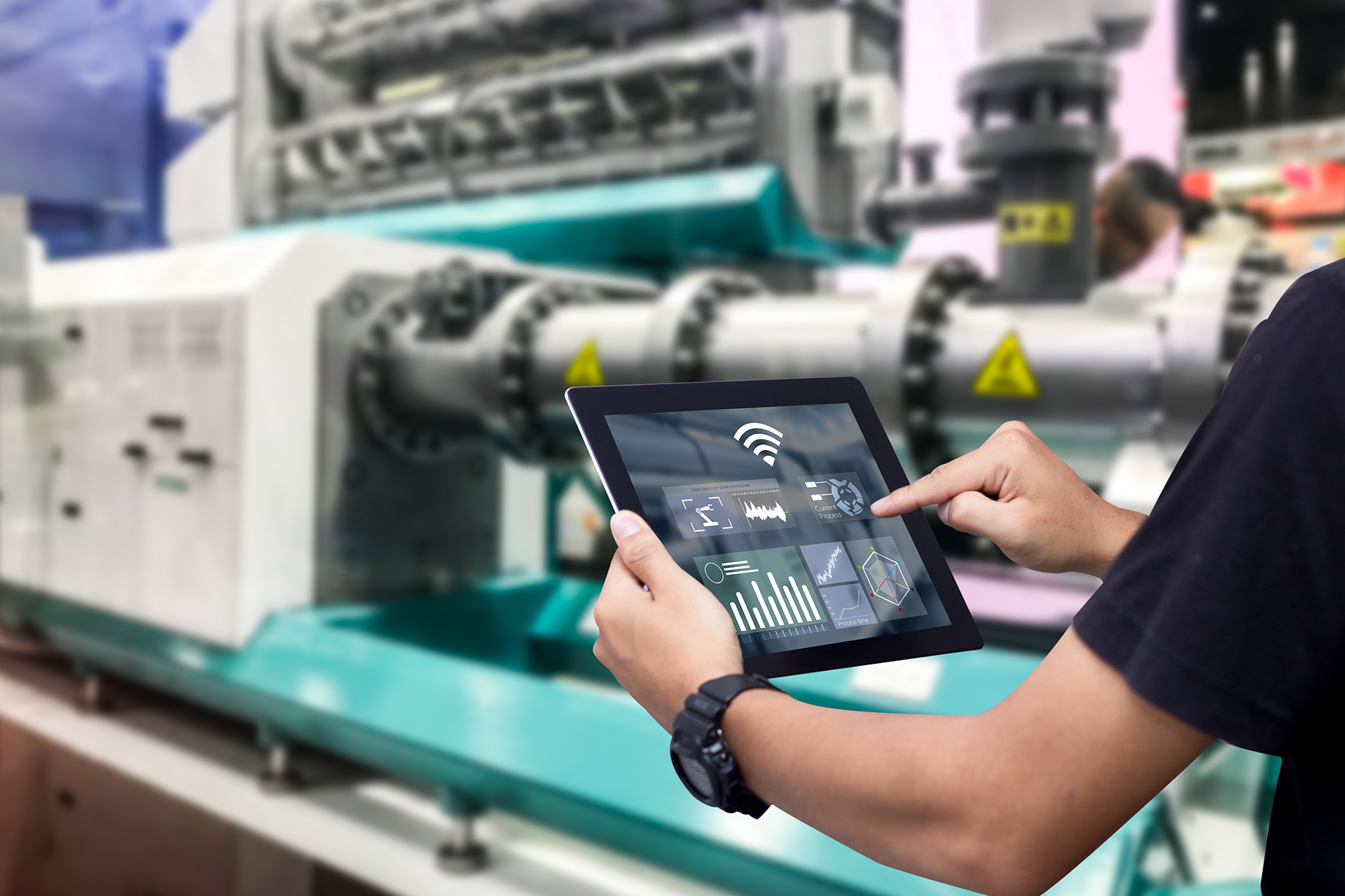 WR8Tech technician using an iPad to inspect mechanical services equipment and record maintenance findings during a commercial building inspection.