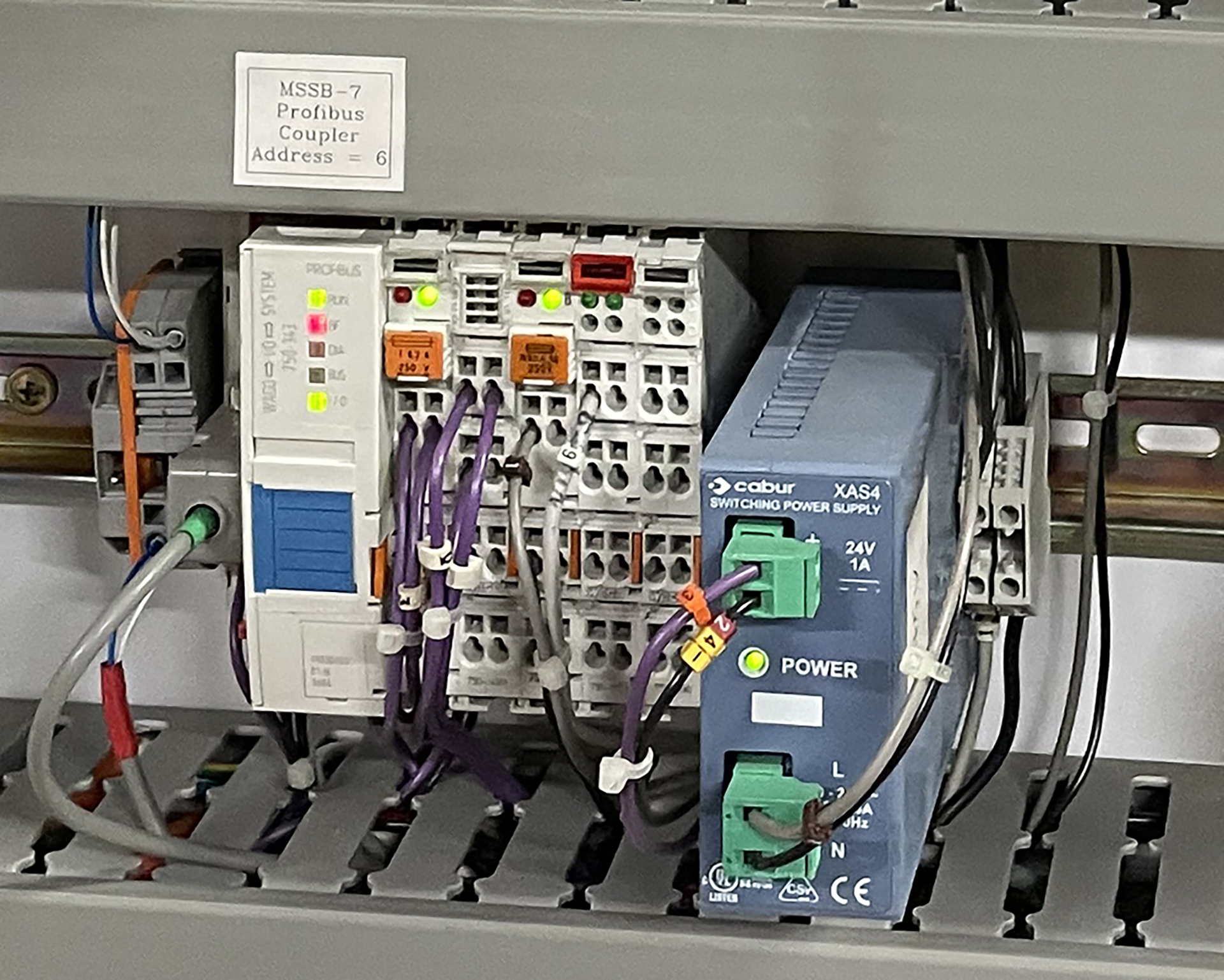 Profibus communication coupler installed inside a commercial mechanical services switchboard for Building Management System communications.