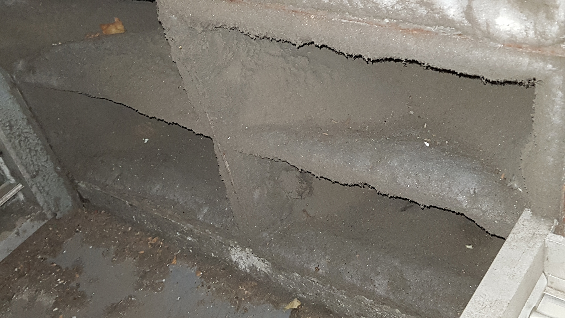 Severely blocked air handling unit filters showing the effects of deferred HVAC maintenance in a commercial building.