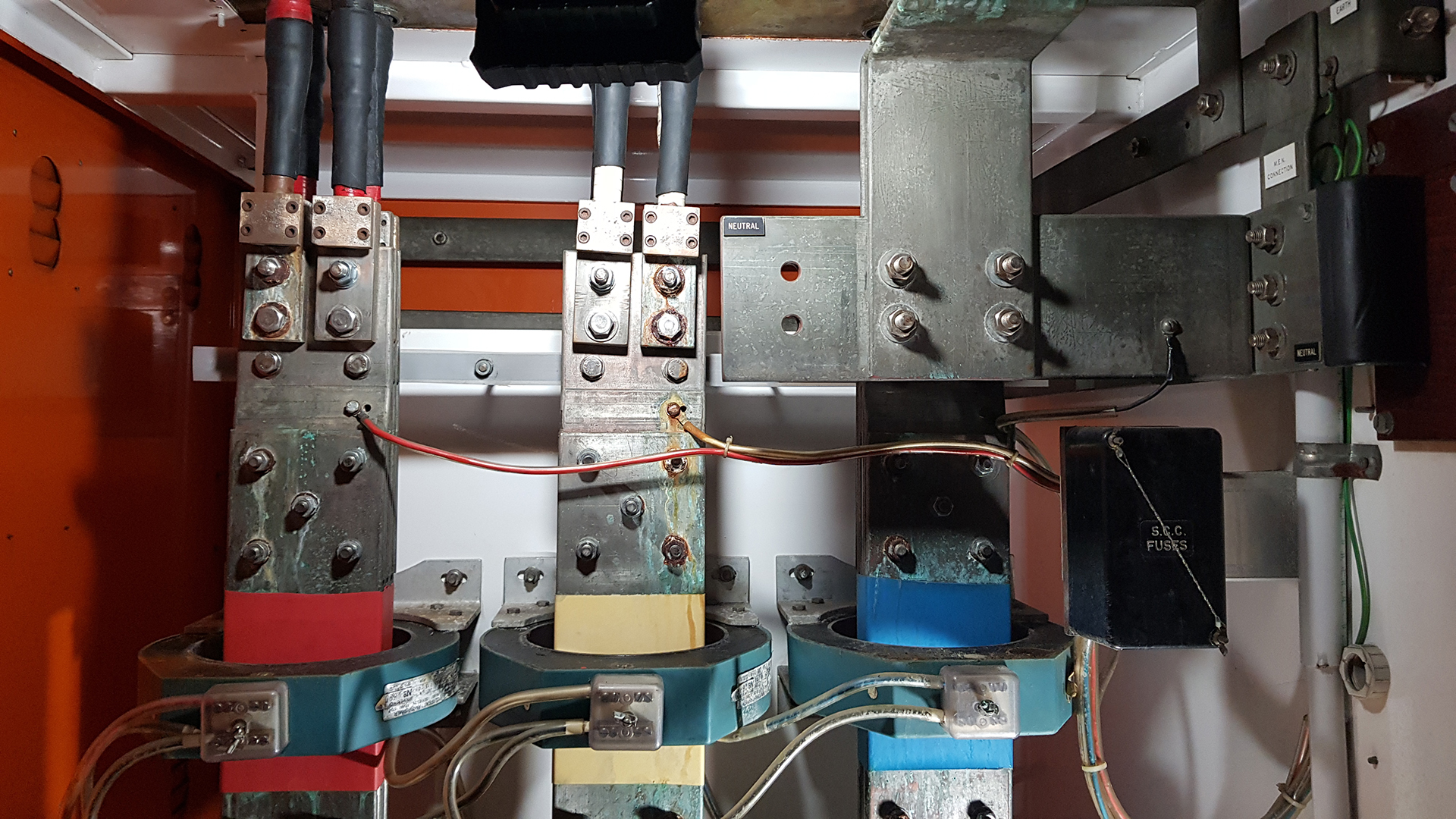Corrosion on busbars and MIMS cable connections inside an ageing mechanical services switchboard on a Sydney project.