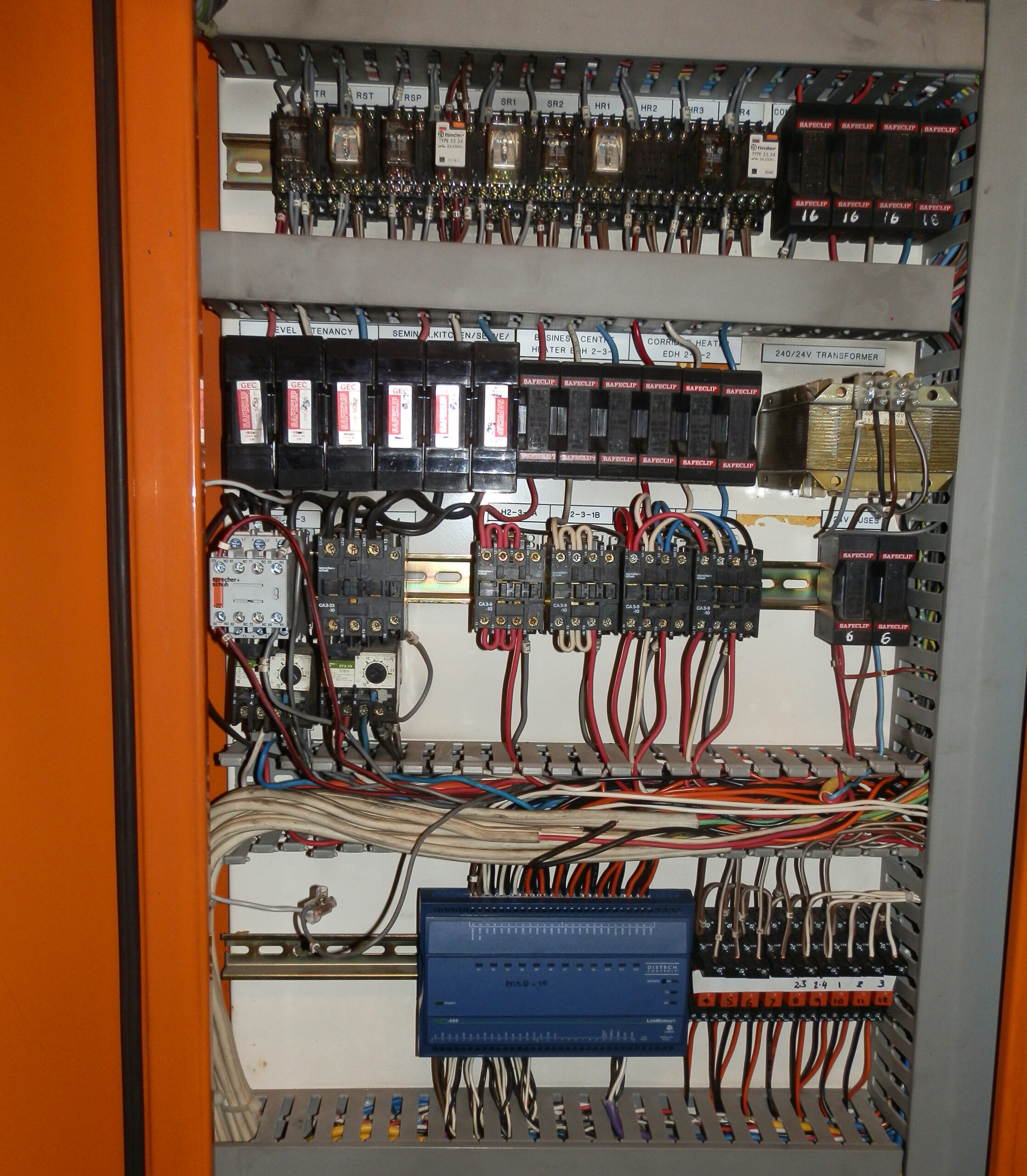 Ageing MSSB panel in a Sydney building showing old HRC fuses and holders, ageing relays, older wiring and no main switch.
