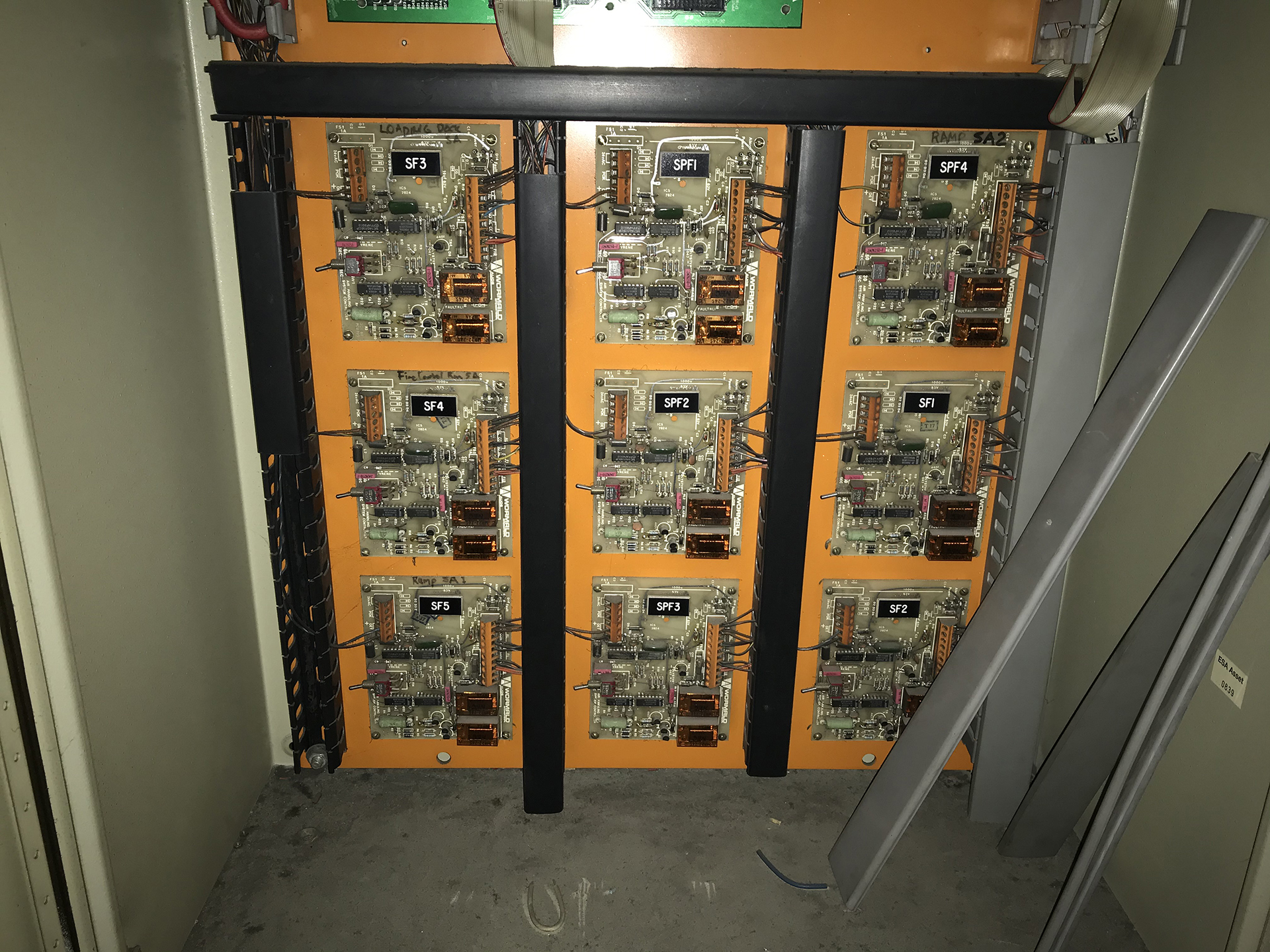 Bank of ageing fan control and interface circuit boards with exposed components, relays and limited diagnostic indication.
