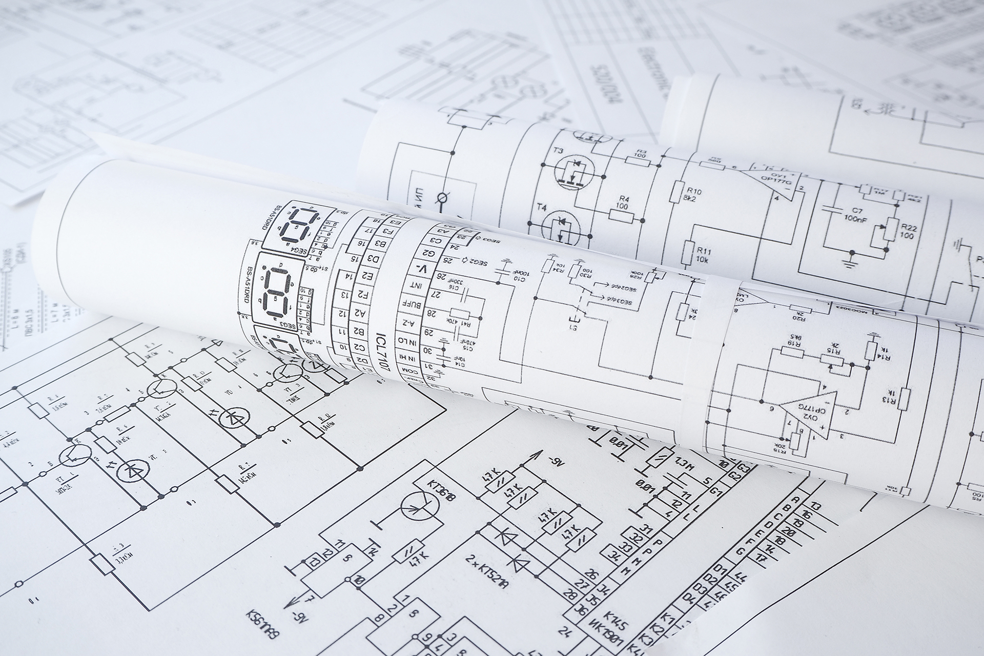Electrical control schematics and engineering drawings used to design Building Management Systems (BMS) for commercial buildings.