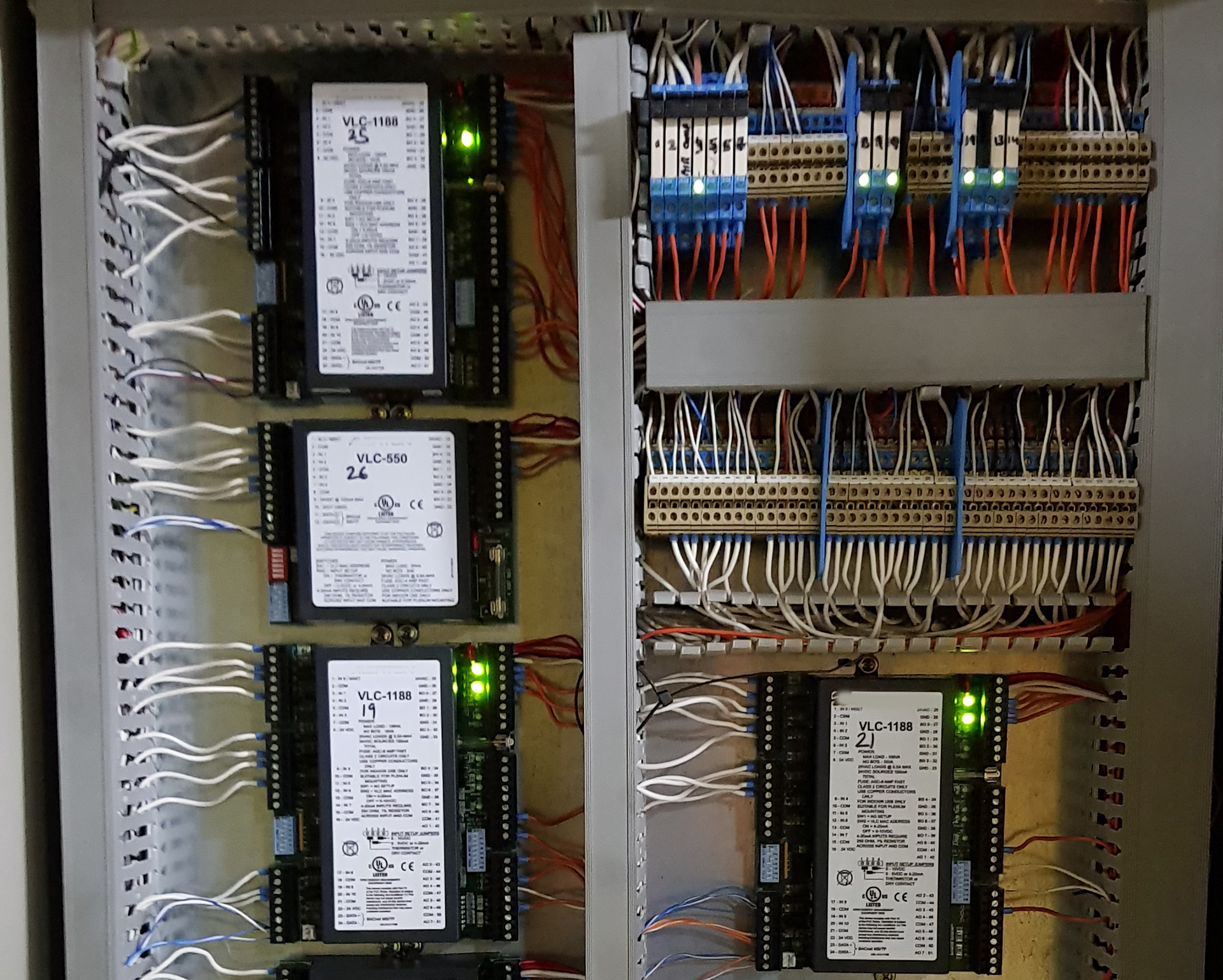 Older Alerton BACnet BMS controllers installed in a commercial building in Sydney, showing existing field controllers and control wiring during BMS recommissioning.