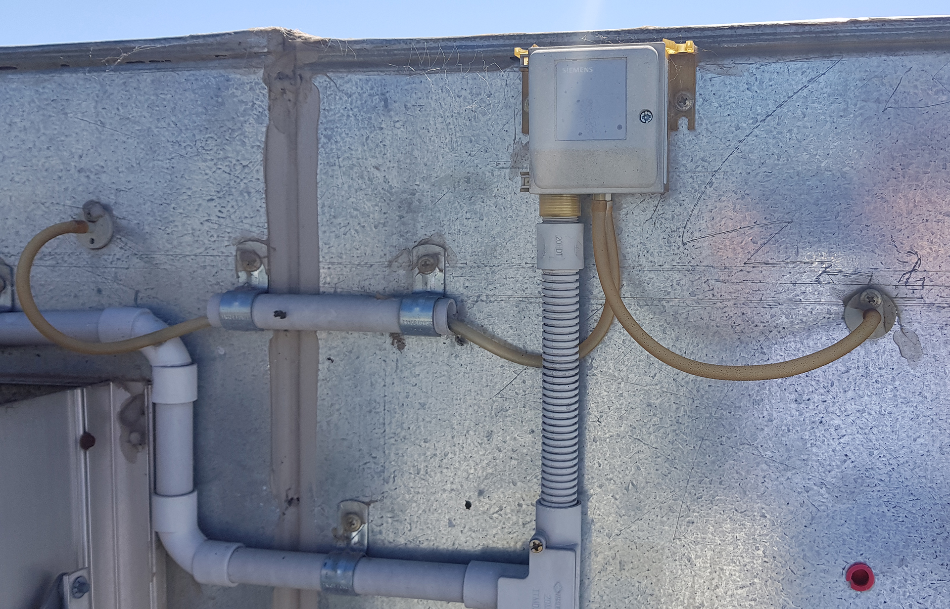 Differential air pressure switch installed across an HVAC filter to provide a dirty filter alarm to the Building Management System.