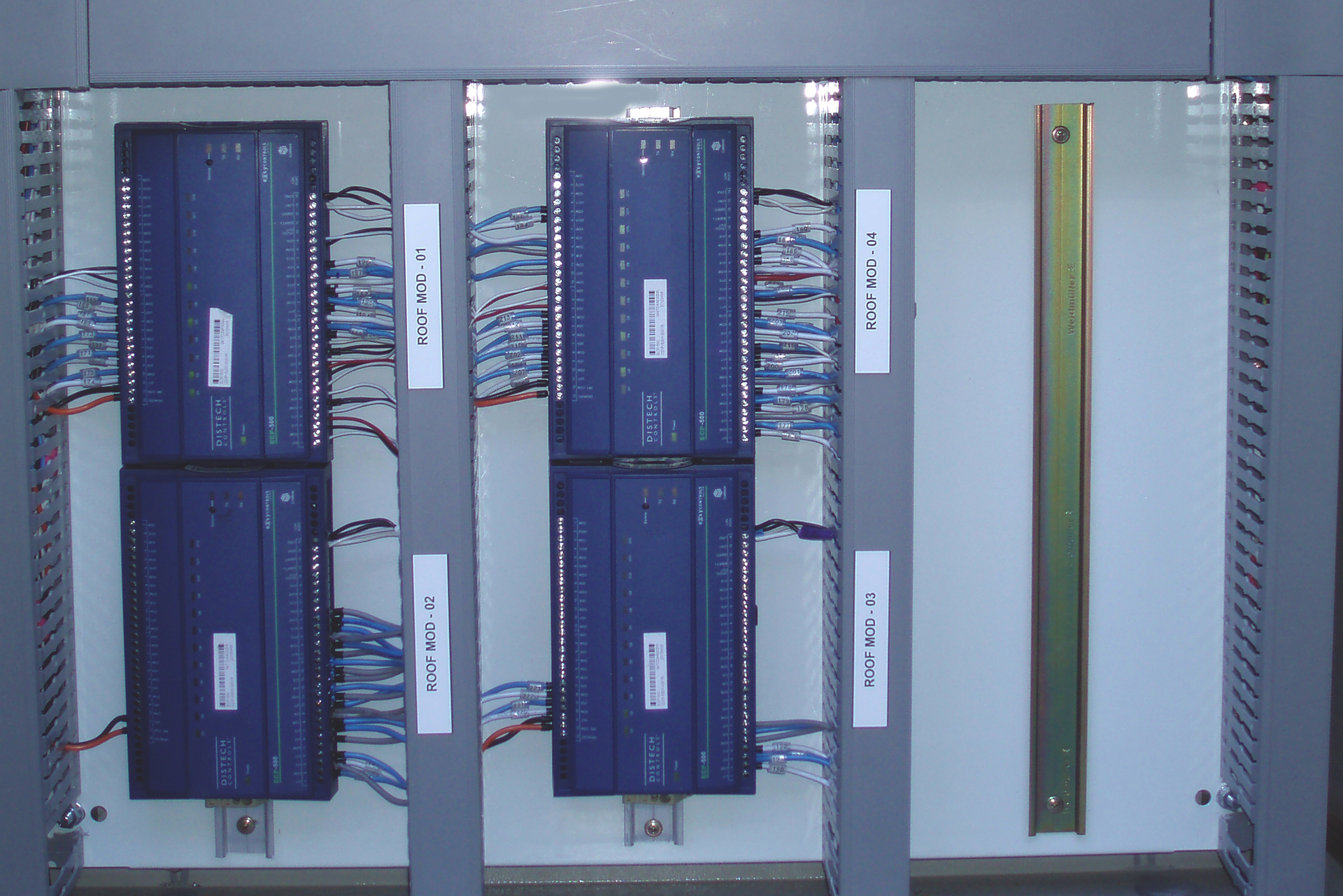 Distech LON BMS controllers installed in a commercial building on Bourke Street, Melbourne, inspected as part of existing building controls and BMS recommissioning.
