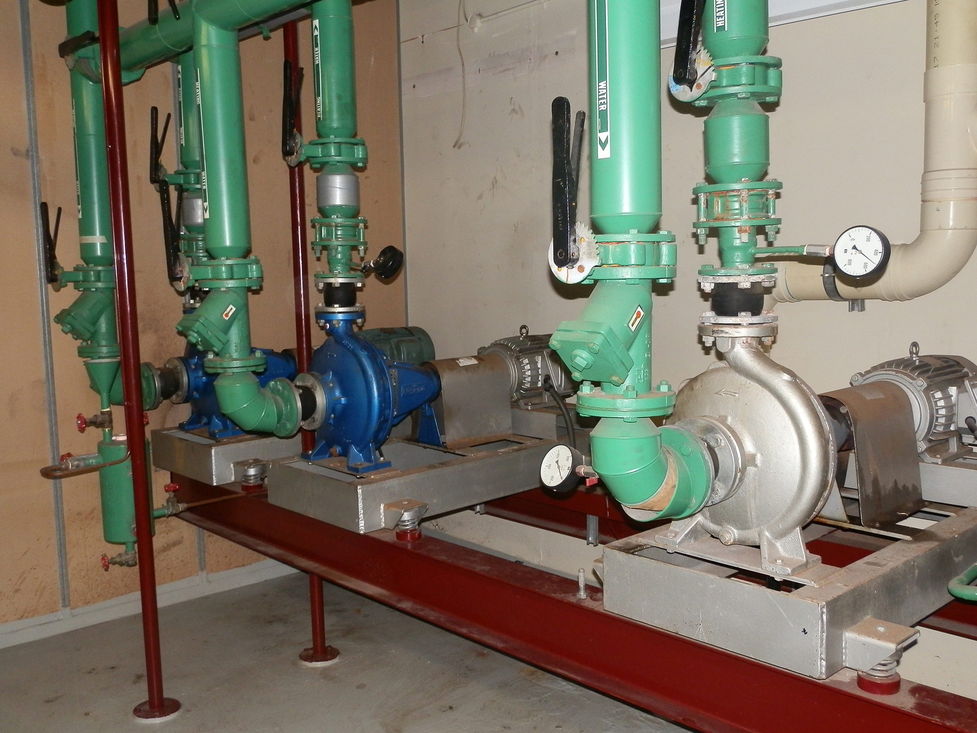 Commercial HVAC water pumps, valves and pressure gauges inspected during BMS recommissioning and functional performance testing.
