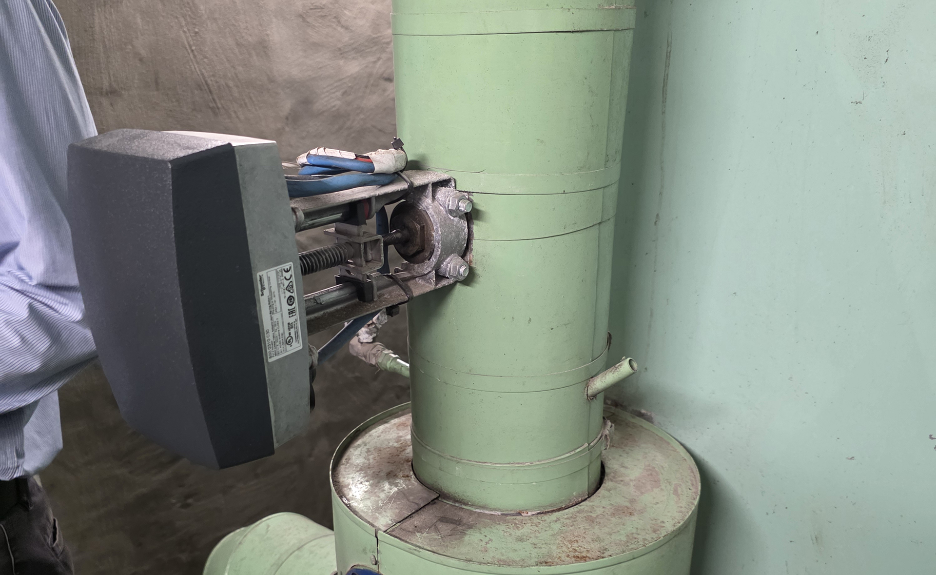 Schneider electric actuator controlling condenser water equipment inspected during BMS recommissioning in a commercial building.